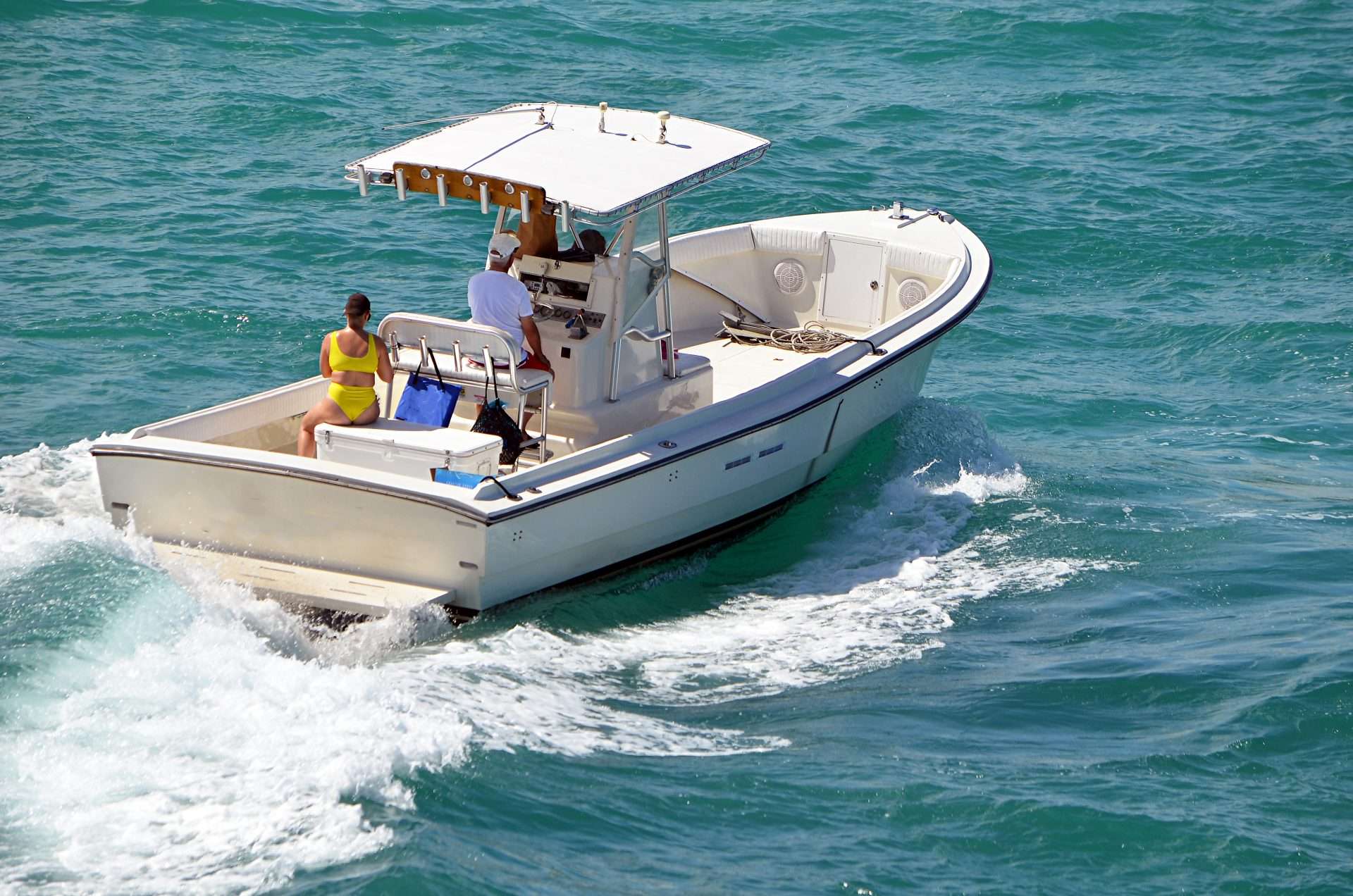 White motor yacht speeding across open water near Clearwater